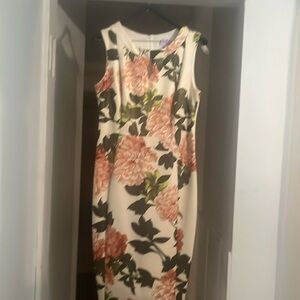 White sleeveless dress with pink and green flowers v cut at the neckline